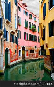Narrow curved canal in Venice, Italy