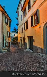 Narrow old street in Italy at night