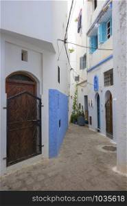 Narrow old street in the medina of Assilah, Morocco