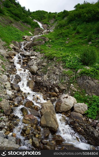 Narrow river on thslope of mount in Lichtenstein