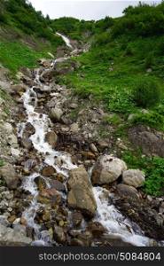 Narrow river on thslope of mount in Lichtenstein