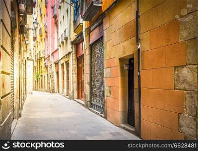 narrow street in Barrio Gotic quarter of Barcelona, Spain, toned. Gotic quarter of Barcelona