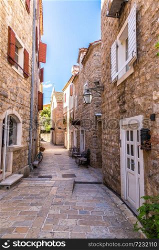 Narrow street in old town in Budva in a beautiful summer day, Montenegro
