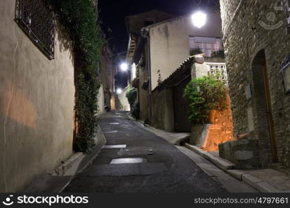 Narrow street in old town in France at night