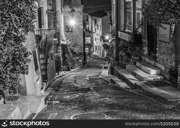 Narrow street in old town in France at night