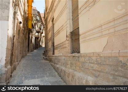 narrow street in Syracuse, Italy