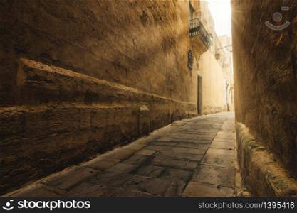 Narrow street in the medieval historic city of Mdina, Malta