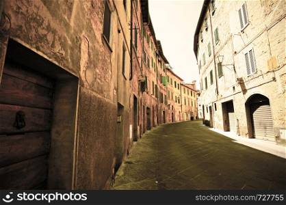 Narrow street in the medieval Italian city of Siena. Retro style