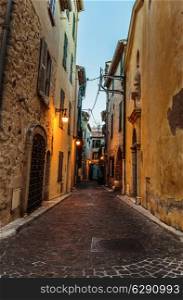 Narrow street in the old town Antibes in France. Night view