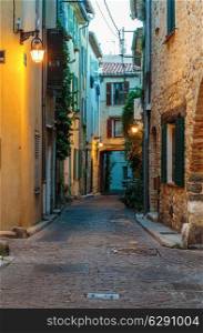 Narrow street in the old town Antibes in France. Night view