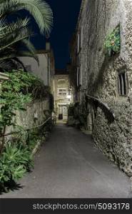 Narrow street in the old town Mougins in France. Night view
