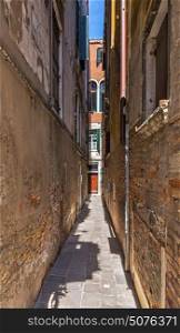 Narrow street in the old town, Venicein Italy