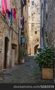 Narrow street in the old village Vence , France.