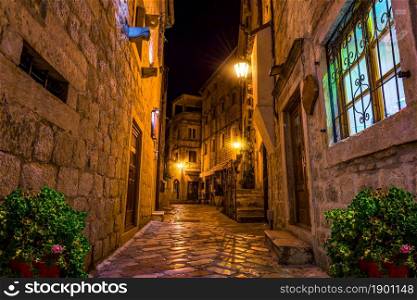 Narrow street of Old Town in Kotor at night. Narrow Kotor street