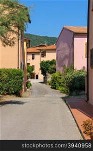 Narrow street of small picturesque town Marciana Marina on Elba Island, Italy