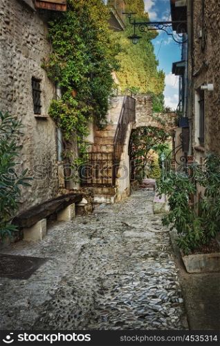 Narrow street with flowers in the old France village