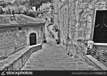 Narrow Street with Old Buildings in Italian City of Sorano, Retro Image Filtered Style