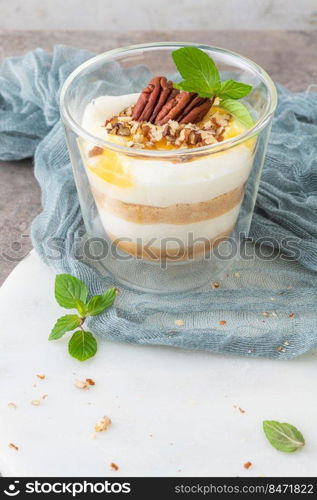 Natas do Ceu is a traditional Portuguese dessert made with cream, eggs and biscuits decorated with pecan nuts and mint leaves