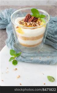 Natas do Ceu is a traditional Portuguese dessert made with cream, eggs and biscuits decorated with pecan nuts and mint leaves