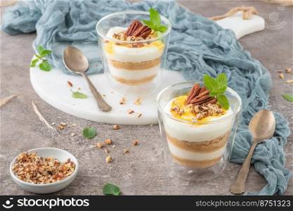 Natas do Ceu is a traditional Portuguese dessert made with cream, eggs and biscuits decorated with pecan nuts and mint leaves