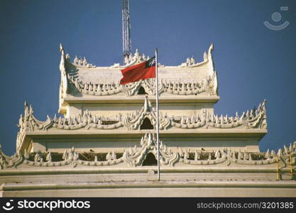 National flag fluttering on a city hall, Yangon, Myanmar