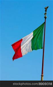 National flag of Italy over clear blue sky