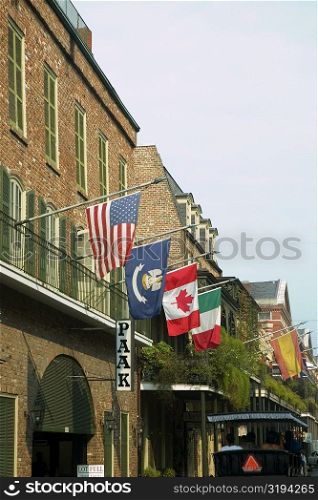 National flags on balconies of buildings, New Orleans, Louisiana, USA