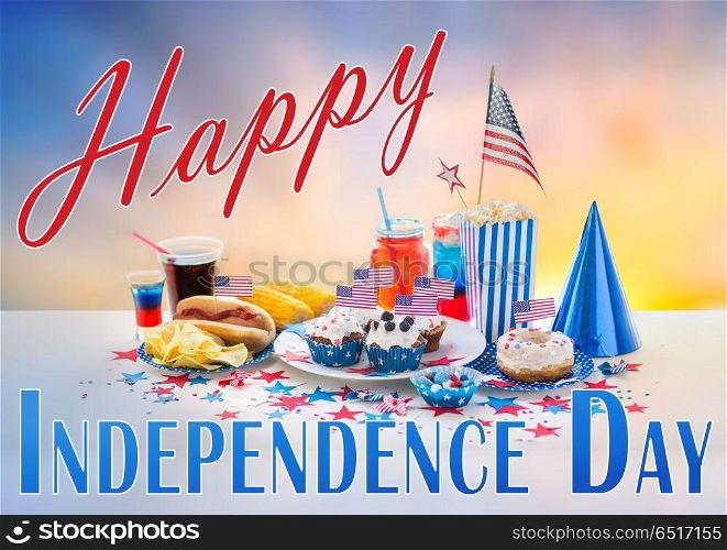 national holidays, celebration and patriotism concept - food and drinks decorated for american independence day party over evening sky background. food and drinks on american independence day party. food and drinks on american independence day party