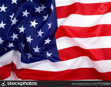 national textile flag of United States of America, surface in waves. Independence Day Background