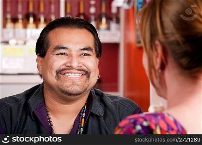 Native American man with female friend in restaurant