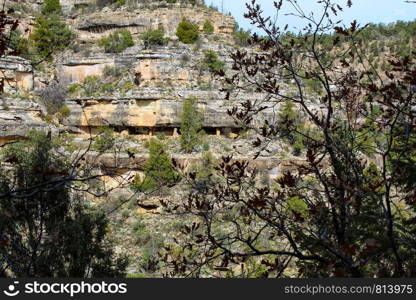 Native American mountain side dwelling from across the canyon in Walnut Canyon National Monument in Flagstaff Arizona