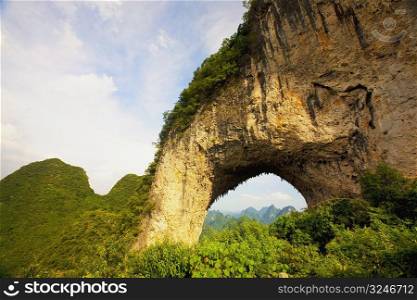Natural arch formed at a hill, Moon Hill, Yangshuo, Guangxi Province, China