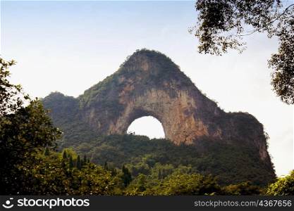 Natural arch formed at a hill, Moon Hill, Yangshuo, Guangxi Province, China