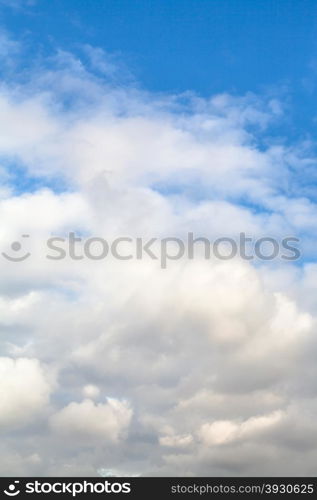 natural background - low dense white autumn clouds in blue sky