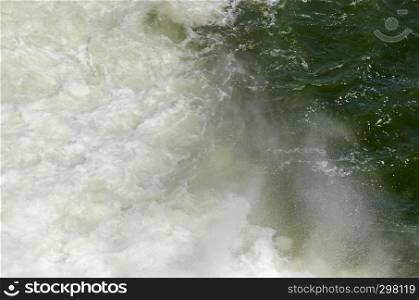 Natural background of fall water from spillway in the dam of resort village Pancharevo, Sofia, Bulgaria, Europe