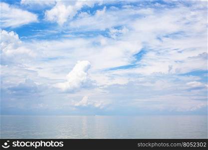 natural background - white clouds over calm blue water Sea of Azov, Temryuk bay, Golubitskaya resort, Taman peninsula, Kuban, Russia
