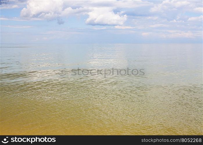 natural background - yellow green calm water Sea of Azov, Temryuk bay, Golubitskaya resort, Taman peninsula, Kuban, Russia
