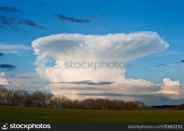 Natural beautiful cloud formation in mushroom cloud shape in blue sky