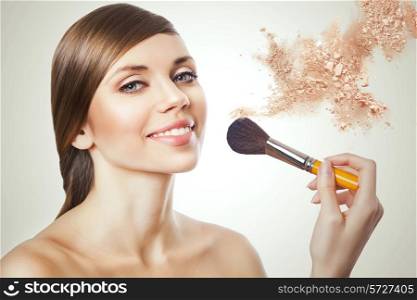 natural beautiful woman with brush and powder