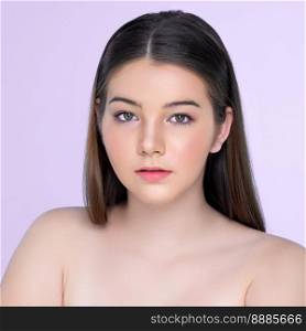 Natural beauty closeup portrait of young charming brunette girl looking at camera. Perfect smooth face skin attractive young girl with bare shoulder for skincare and cosmetic product.. Natural beauty concept closeup portrait of young charming brunette girl.