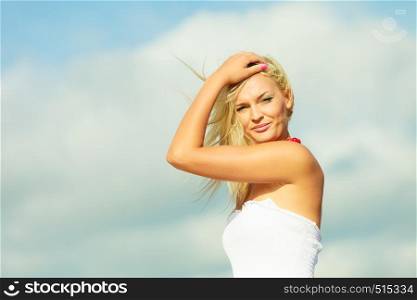 Natural beauty of women. Young attractive blonde woman on sky background. Portrait of gorgeous girl in summer time.. Beauty blonde woman portrait on sky background.