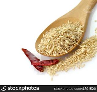 Natural brown rice in a wooden spoon