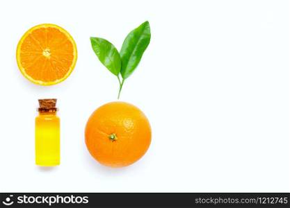 Natural citrus oil with fresh orange fruit and green leaves on white background. High vitamin C. Copy space