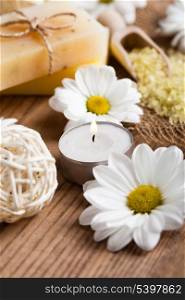 Natural cosmetics concept: soap with daisies