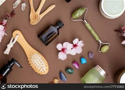 Natural cosmetics top view set on earth tones brown background. Natural cosmetics set