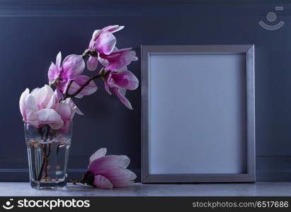 Natural eco home decor. Gray room interior decor with magnolia flowers and poster mock up