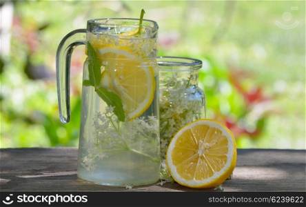 Natural elderflower juice with lemon and elder tree flowers