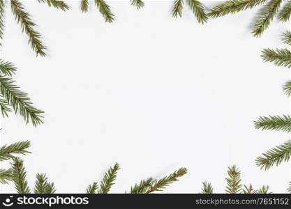 Natural fir Christmas tree border frame isolated on white , copy space for text. Fir tree branch frame on white