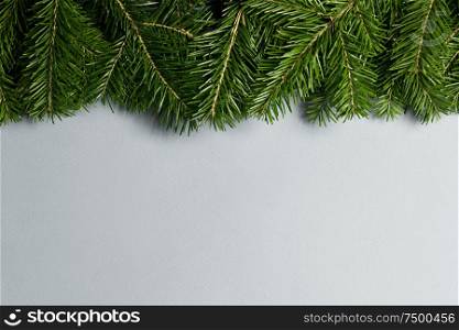 Natural fir Christmas tree border frame on white , copy space for text. Fir tree branch frame on white