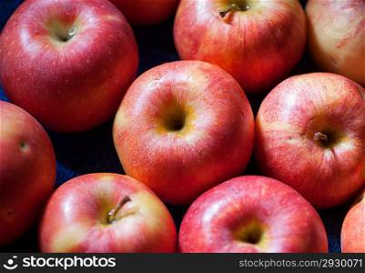 Natural fresh organic apples - Closeup of many red-yellow juicy apple fruits in market